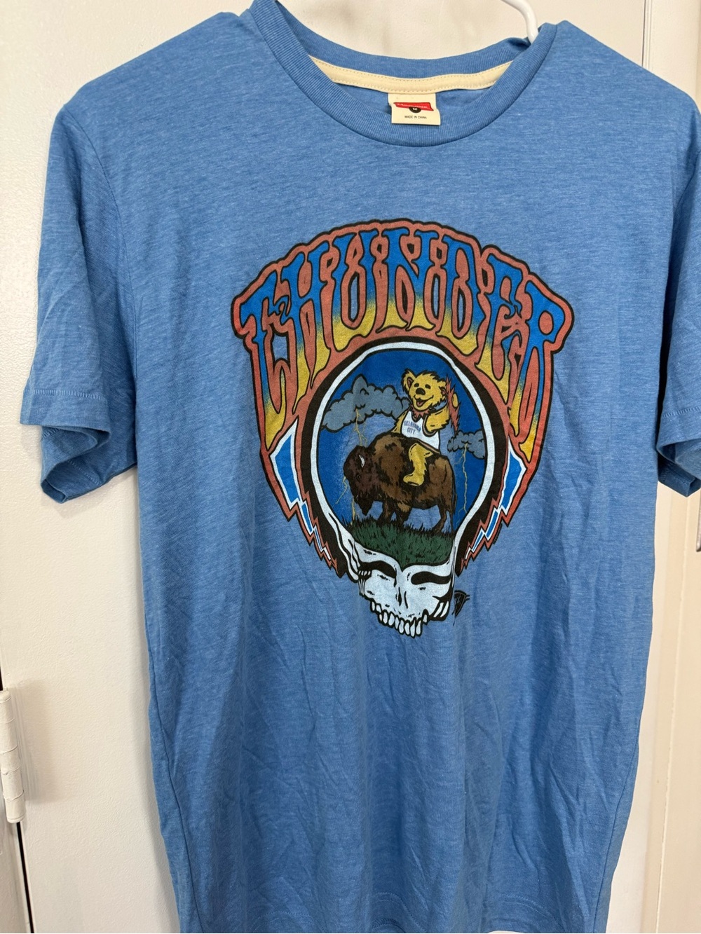 This is a light blue Homage Oklahoma City Thunder Blue Grateful Dead x Thunder